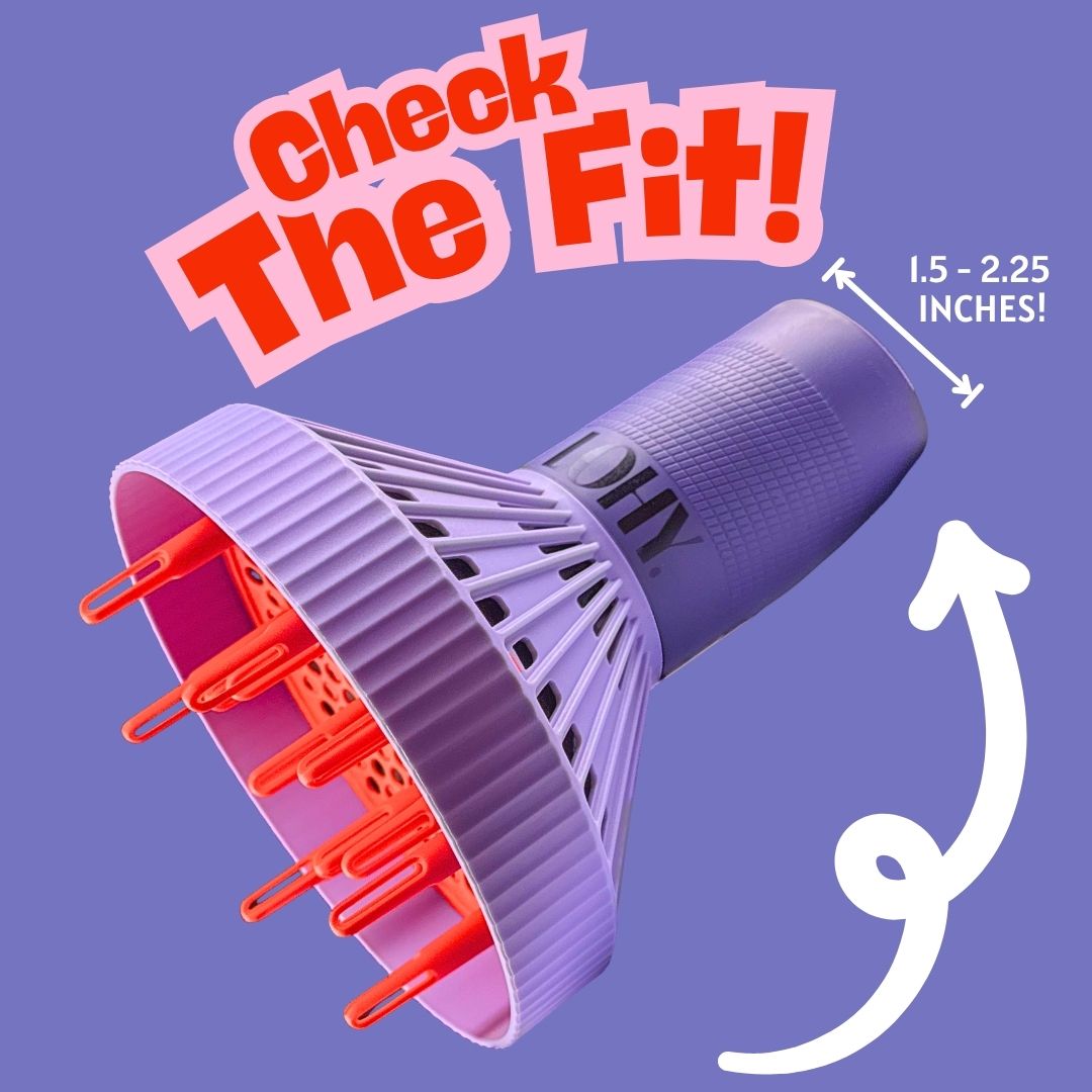 A purple and pink hair dryer nozzle tip with orange-red bristles, shown on a lavender background with the text 'Check The Fit!' and a measurement callout reading '1.5 - 2.25 inches!'.