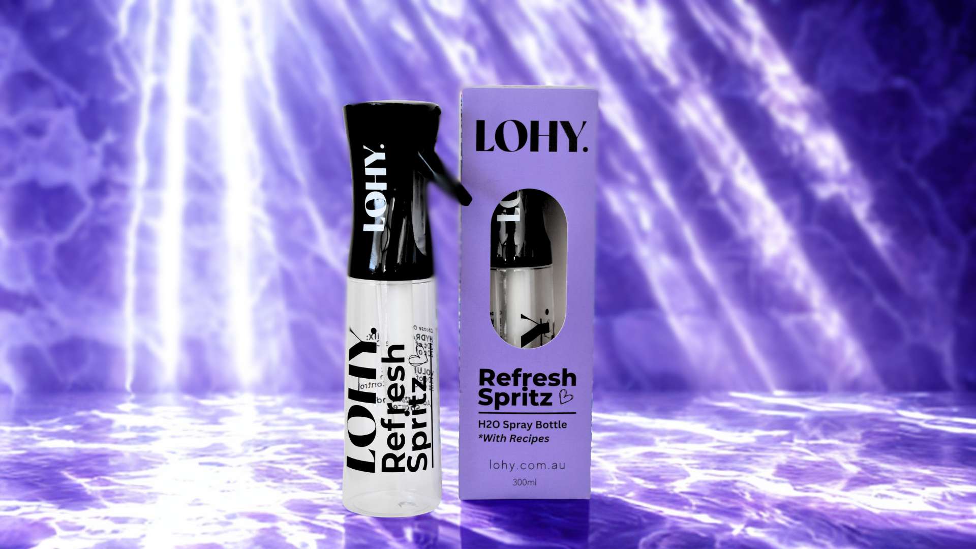 LOHY. Refresh Spritz spray bottle sitting on purple bench with water caustic reflections, next to a Refresh Spritz box with text on box "LOHY. Refresh Spritz, H2O Spray Bottle *With Recipes lohy.com.au 300ml"