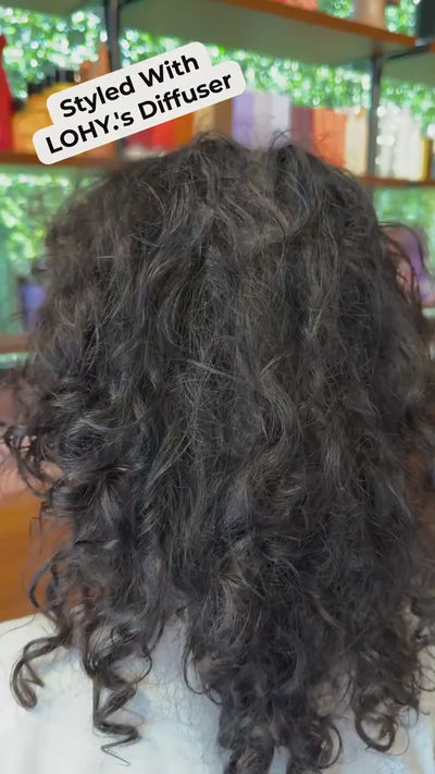 CLose up of hair filling the frame, before and after curl footage in a salon 