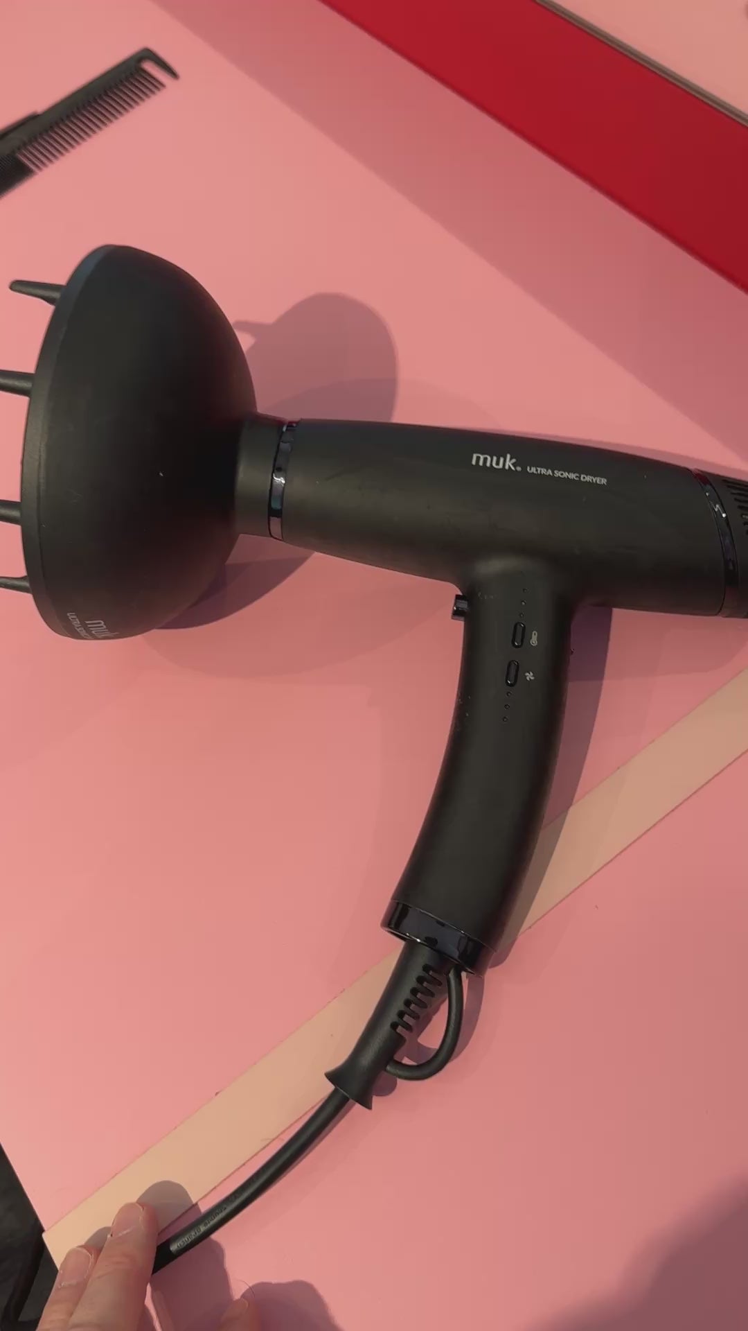 Load video: Black MUK hiardryer being fitted to a Curl flow dryer
