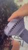 Close up of the curl flow being used on curly hair dark hair, orange and purple diffuser 