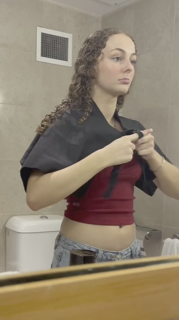 Load video: woman with brunette blonde wavy hair shows how to perform LOHY. hero routine which turns her frizzy hair to soft defined curls