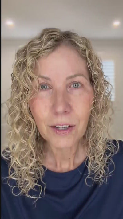wavy haired, blonde hair lady showing LOHY's universal curl flow diffuser and defined soft curly hair results