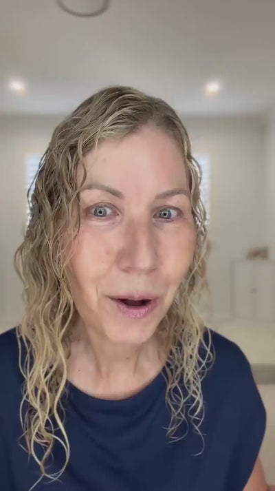 wavy haired, blonde hair lady showing LOHY's universal curl flow diffuser and defined soft curly hair results