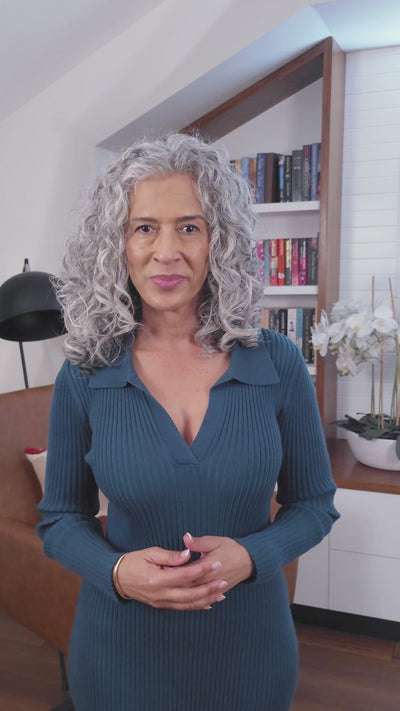 curly haired, grey hair, lady showing LOHY's universal curl flow diffuser