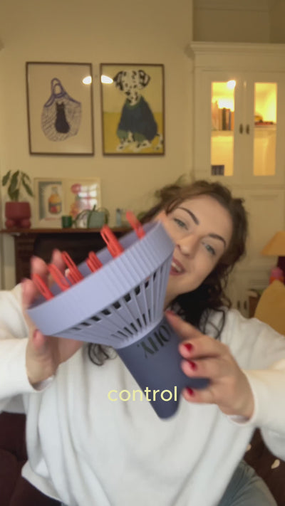 wavy haired, brunette, lady showing LOHY's universal curl flow diffuser